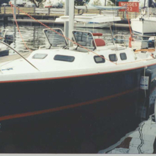Rhodes 22 in her slip at a boat show (Photo courtesy of General Boats)
